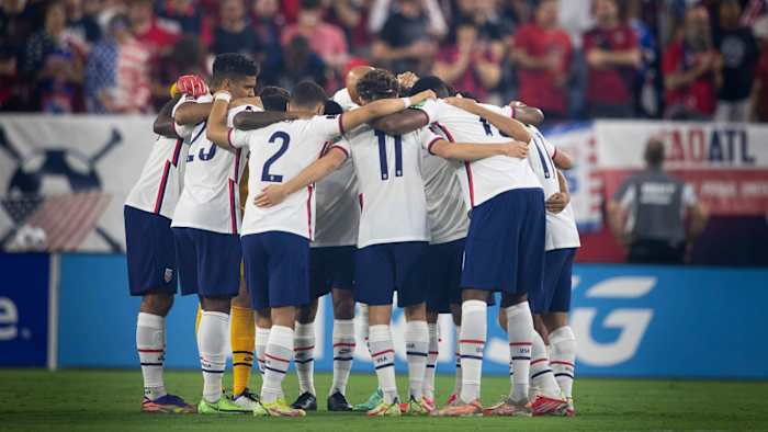 The USMNT huddles during a World Cup qualifier
